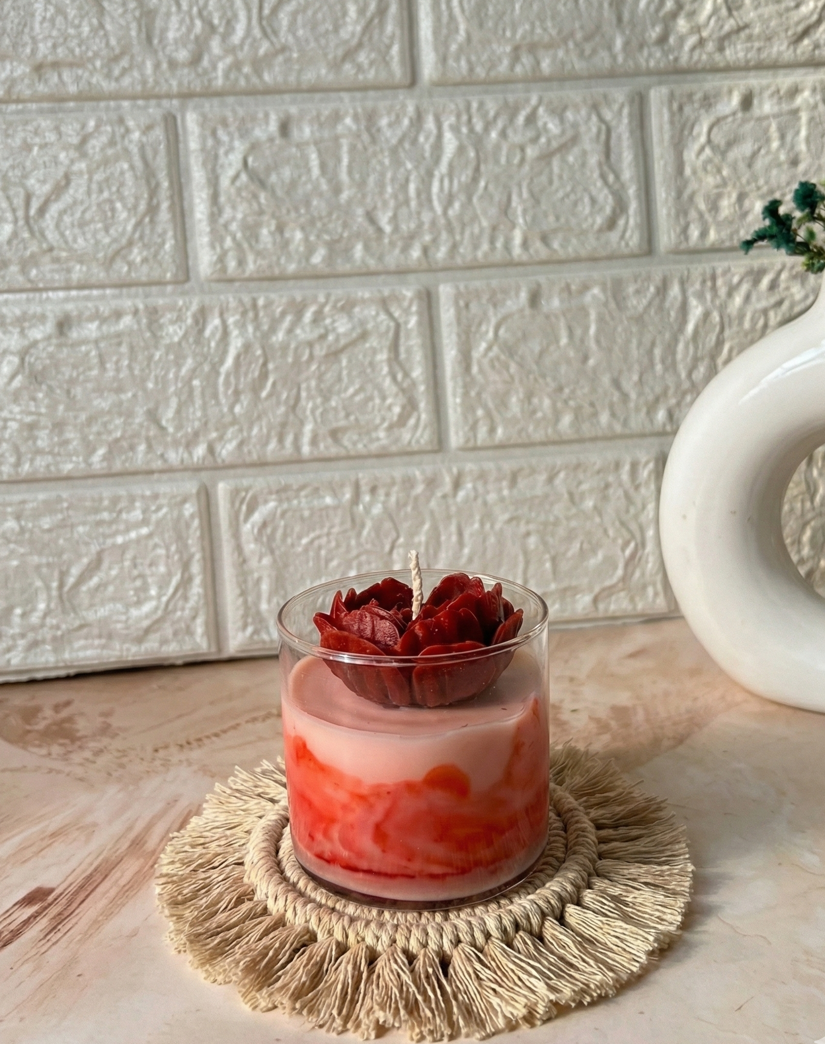 Crimson red marble jar candle with a hand-carved dark red rose bloom topper made up of soy wax