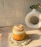 Crimson yellow marble jar candle with a hand-carved dark red rose bloom topper made up of soy wax