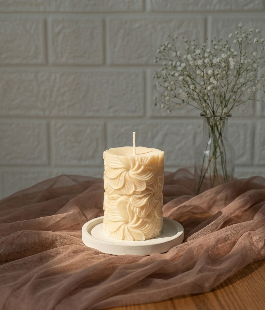 Our Wind Whirl Pillar Candle combines soft floral detailing with a smooth, creamy finish. Made using high-quality soy wax, it burns cleanly and looks stunning as décor, adding a touch of natural elegance wherever you place it