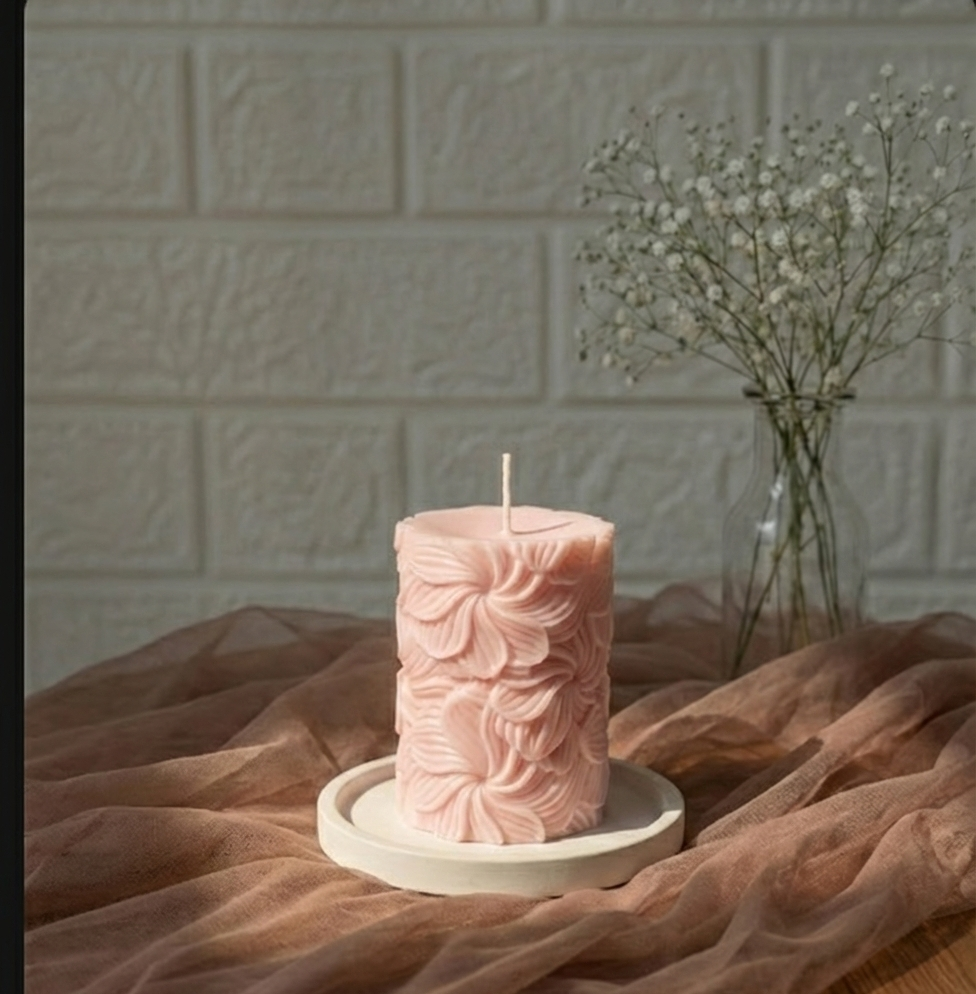 Our Wind Whirl Pillar Candle combines soft floral detailing with a smooth, creamy finish. Made using high-quality soy wax, it burns cleanly and looks stunning as décor, adding a touch of natural elegance wherever you place it.