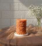 Our Wind Whirl Pillar Candle combines soft floral detailing with a smooth, creamy finish. Made using high-quality soy wax, it burns cleanly and looks stunning as décor, adding a touch of natural elegance wherever you place it.