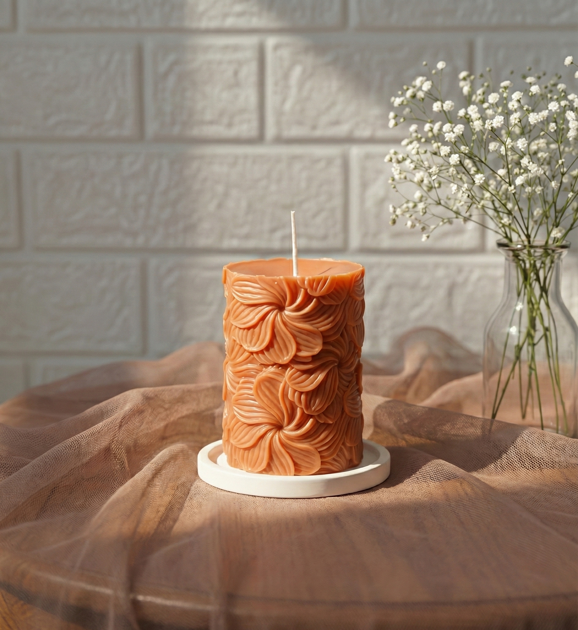 Our Wind Whirl Pillar Candle combines soft floral detailing with a smooth, creamy finish. Made using high-quality soy wax, it burns cleanly and looks stunning as décor, adding a touch of natural elegance wherever you place it.